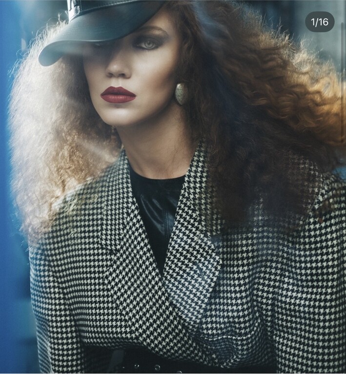 Urban fashion editorial with a red-haired model