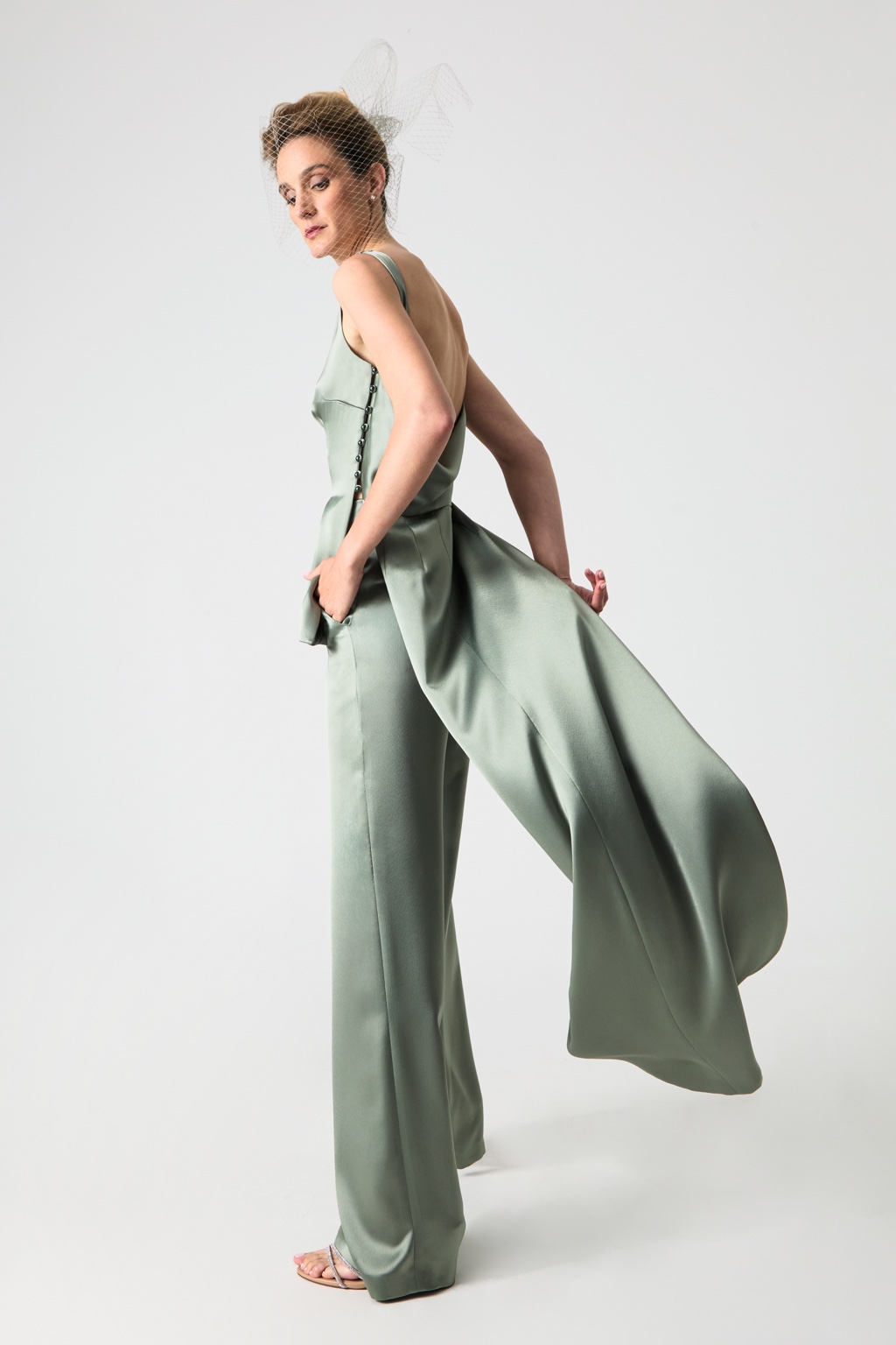 Green satin trousers in motion by Fely Campo